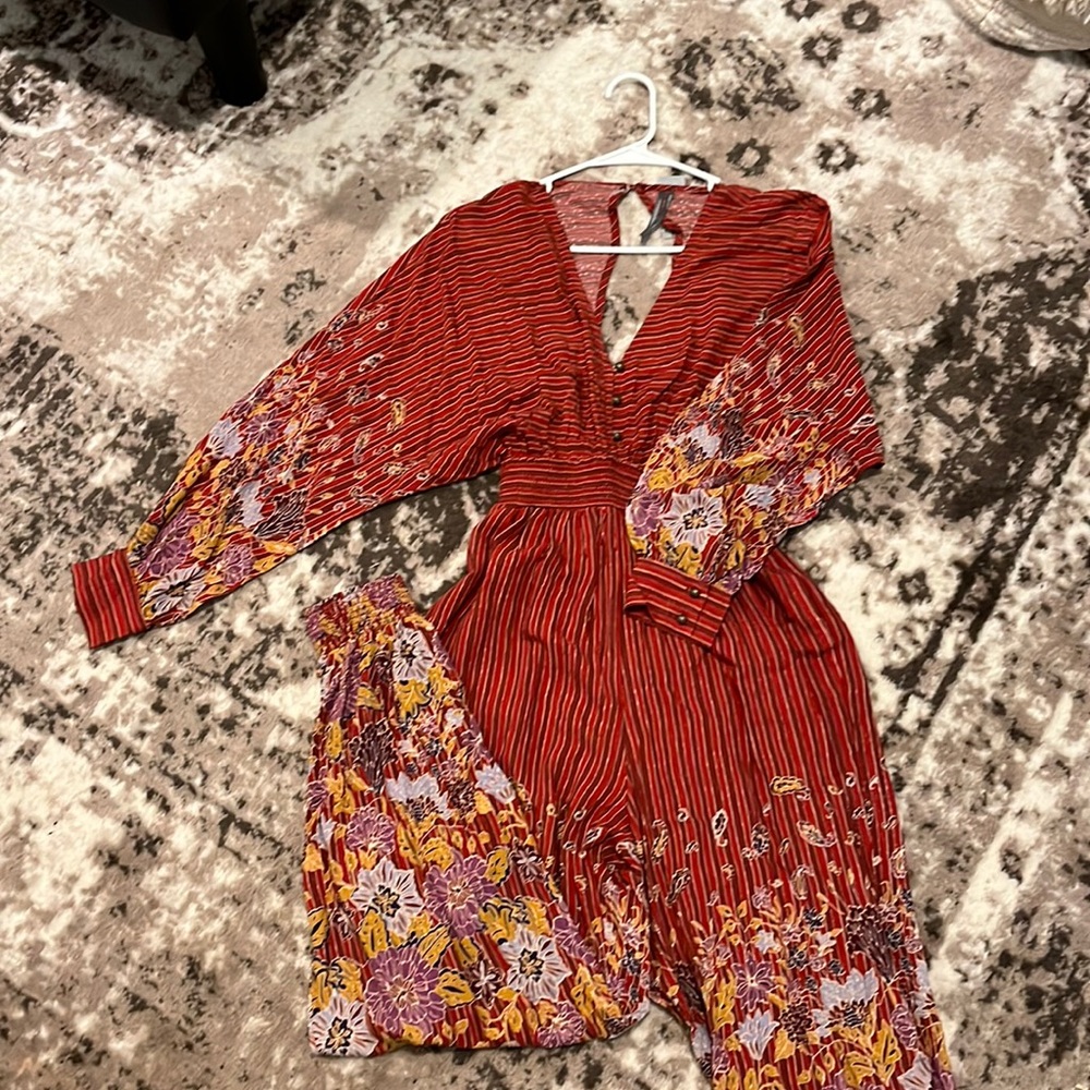 Anthropologie Petite Jumpsuit- Rust colored with stripes and floral design.